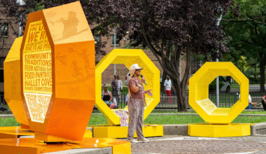 octagonal forms marked with community voices shape queens landmark