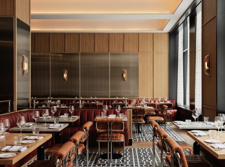 A brasserie featuring panelled walls and mosaic flooring