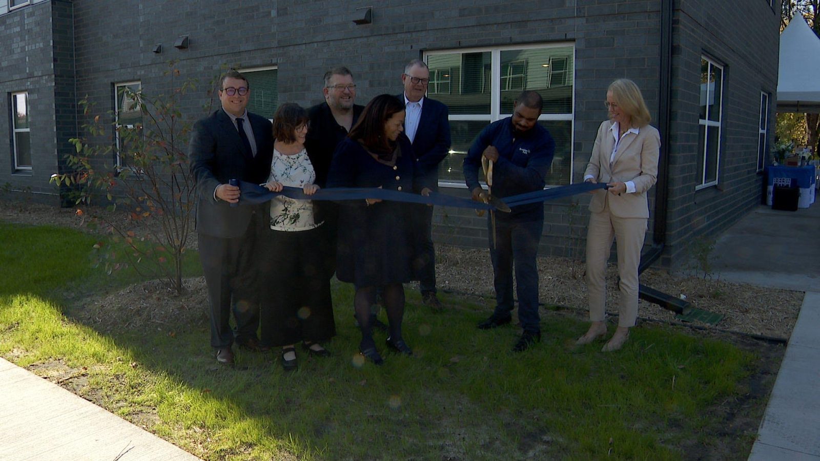 Ribbon cutting ceremony at Sandgrass Pointe affordable housing project.