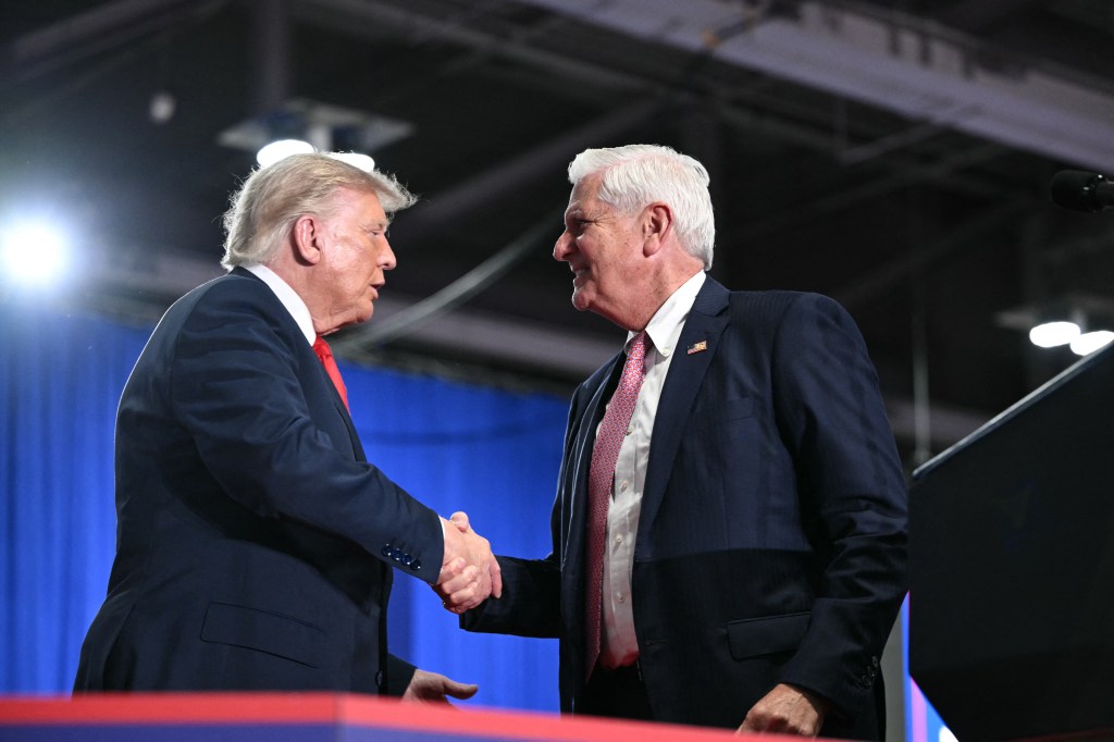 US President Donald Trump shakes hands with Republican candidate for New York governor Bruce Blakeman.