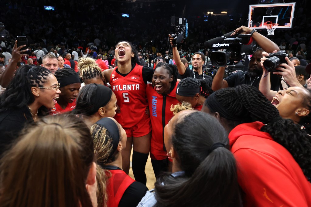 The Atlanta Dream celebrate after defeating the New York Liberty in game three of the SemiFinals of the WNBA Playoffs at Barclays Center.