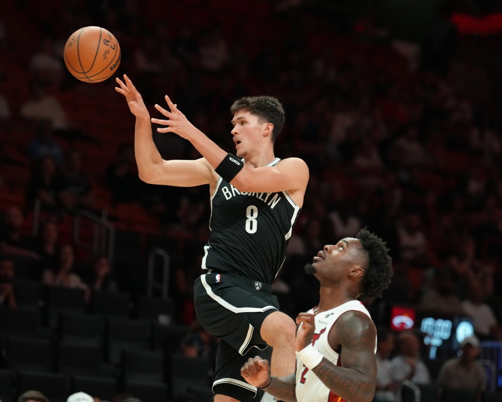 Egor Demin of the Brooklyn Nets passes the ball during a game against the Miami Heat.
