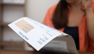 A woman looking at a utility bill.
