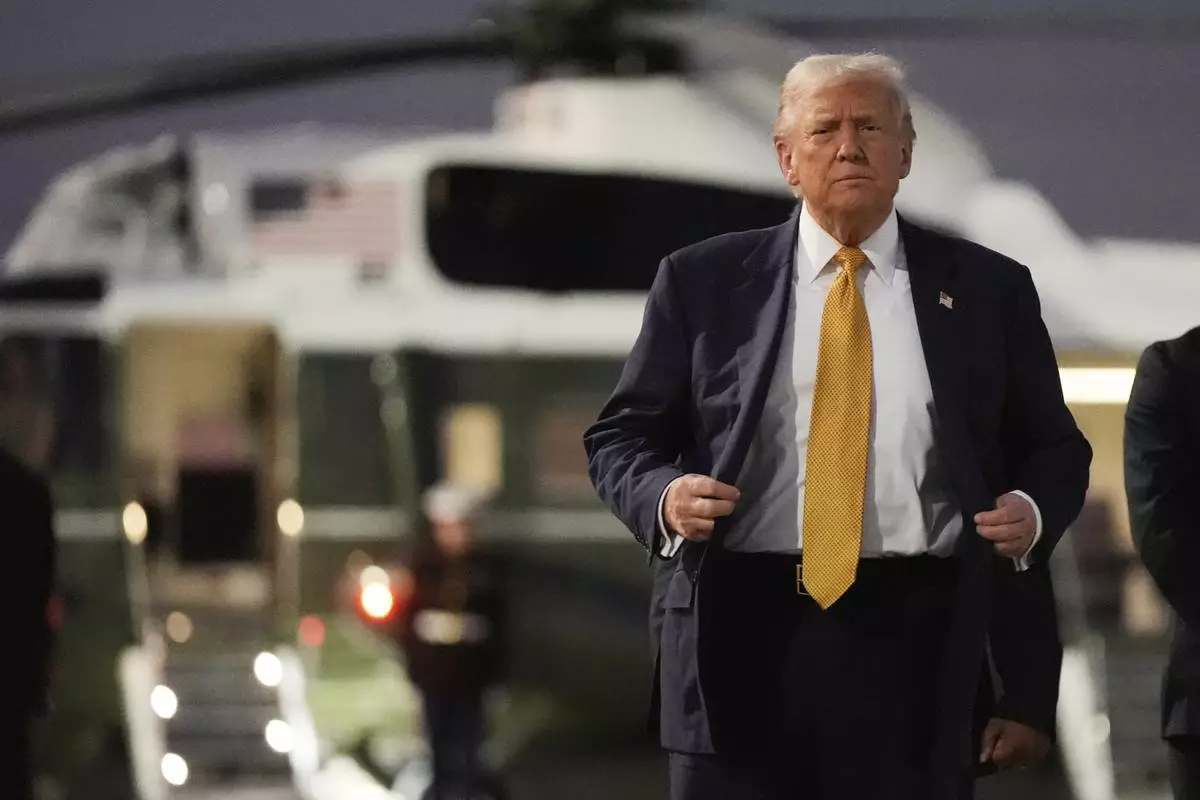 President Donald Trump arrives at Haneda Airport before switching his ride to Marine One in Tokyo, Japan, Monday, Oct. 27, 2025, following his visit at the ASEAN summit in Malaysia. (AP Photo/Mark Schiefelbein)