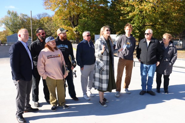 Mayor Paige Gebhardt Cognetti, center, addresses a crowd Tuesday at...