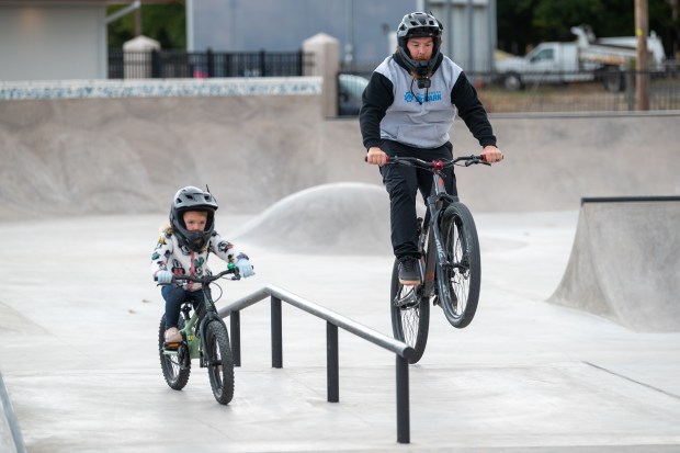 Shaun Taylor catches air while riding bikes with his daughter...