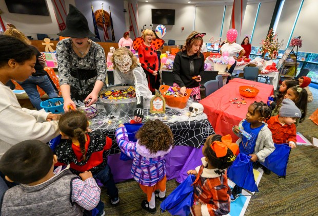 Local downtown daycares and preschools children receive treats Friday, Oct. 31, 2025, during a Trick-or-Treat Candy Land themed adventure hosted by Lehigh County at Government Center in Allentown. (April Gamiz/The Morning Call)
