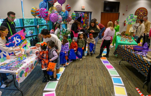 Local downtown daycares and preschools children receive treats Friday, Oct. 31, 2025, during a Trick-or-Treat Candy Land themed adventure hosted by Lehigh County at Government Center in Allentown. (April Gamiz/The Morning Call)