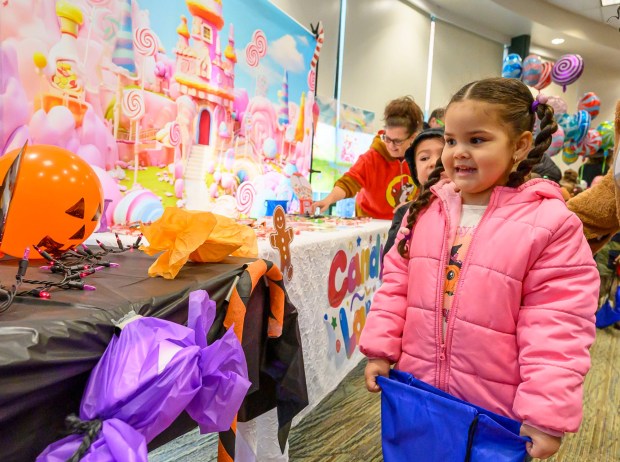 Scarlet, Resurrected Life Children's Academy receives treats on Friday, Oct. 31, 2025, during a Trick-or-Treat Candy Land themed adventure hosted by Lehigh County at Government Center in Allentown. (April Gamiz/The Morning Call)