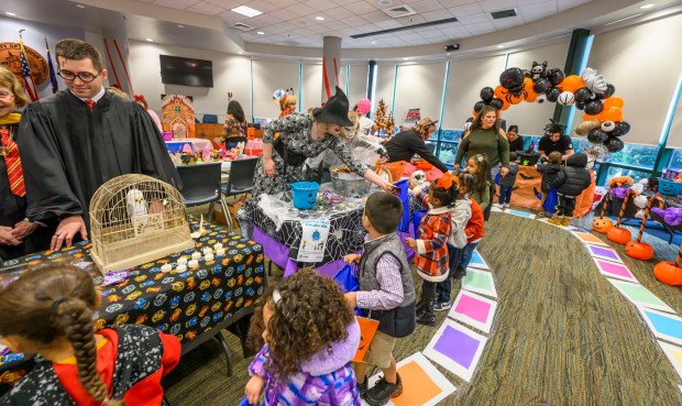 Local downtown daycares and preschools children receive treats Friday, Oct. 31, 2025, during a Trick-or-Treat Candy Land themed adventure hosted by Lehigh County at Government Center in Allentown. (April Gamiz/The Morning Call)