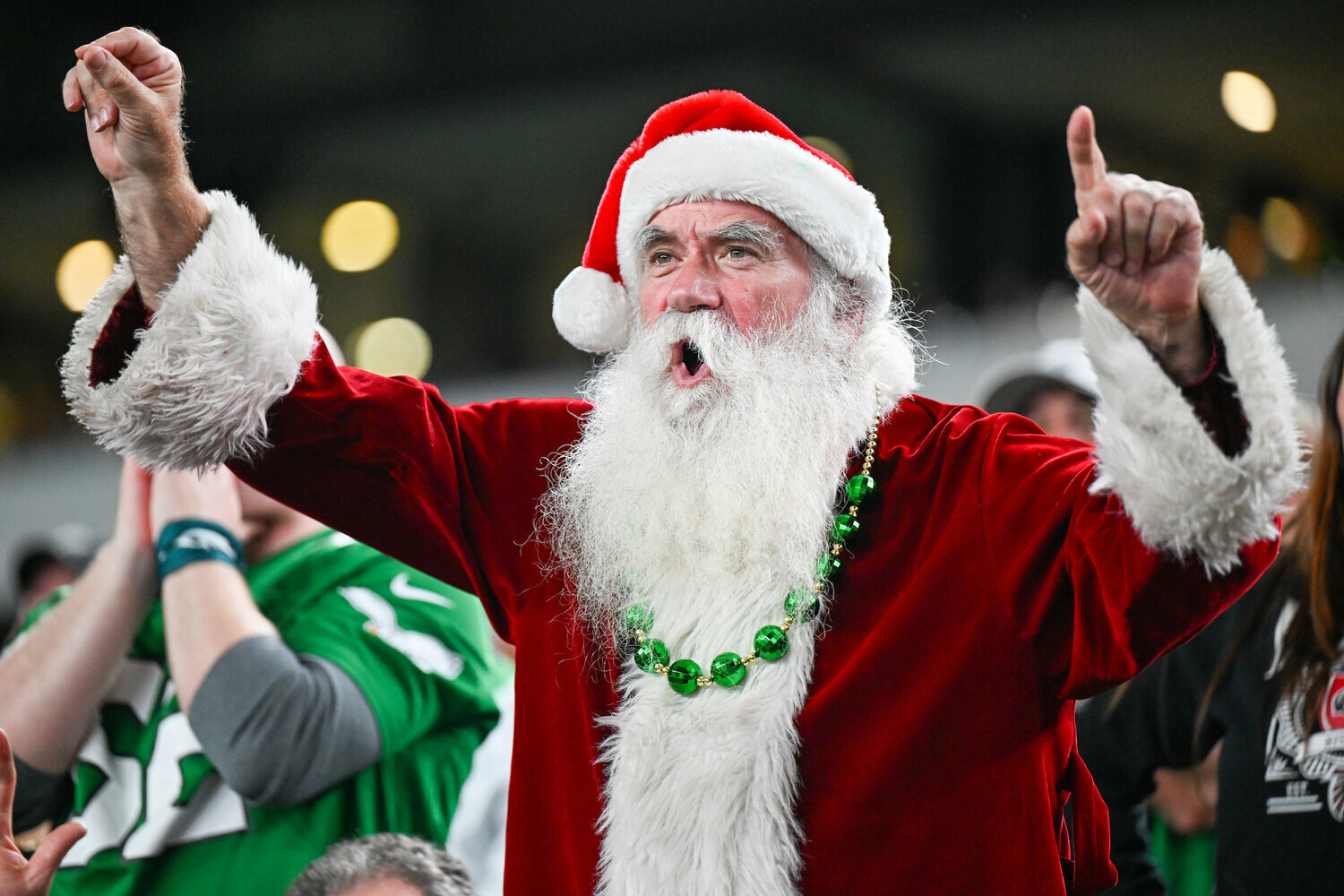 In this file photo, a fan dressed as Santa cheers on the Eagles at Lincoln Financial Field.