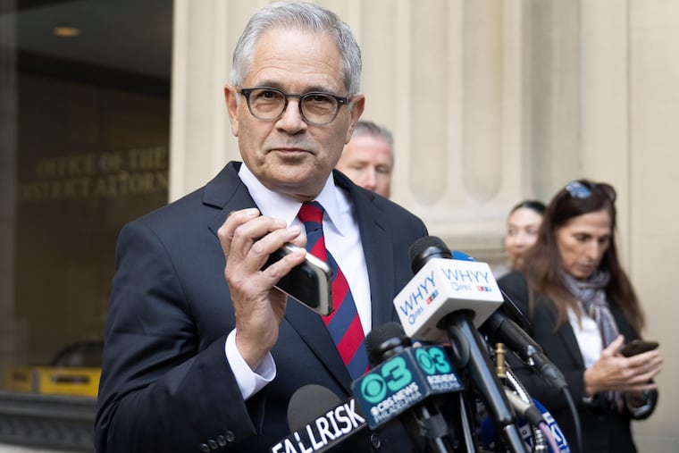 Newly reelected District Attorney Larry Krasner walks out of his office playing “Blow the Whistle” on his phone minutes before speaking to reporters during a press conference outside the District Attorney’s Office, Wednesday, Nov. 5, 2025, in Philadelphia.