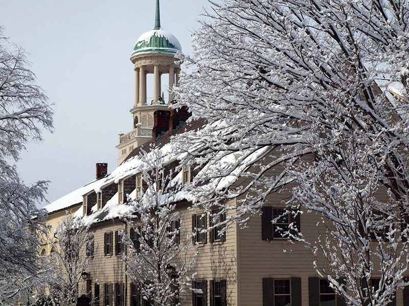 Snow on the roof and trees of a historic building in Bethlehem, PA