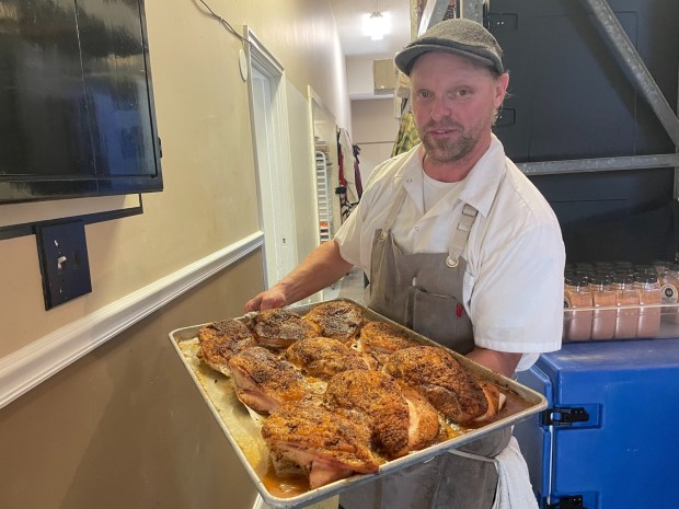 Chef CJ Deery moves some of the food from the kitchen to the serving areas on Nov. 18, 2023, during the Community Thanksgiving in Media. Another community dinner is coming up and organizers need your help. (KATHLEEN E CAREY - DAILY TIMES)