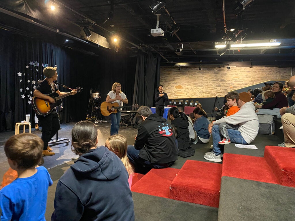 Professional musicians lead a songwriting workshop with kids and families at the Please Touch Museum’s Wonder Theater.