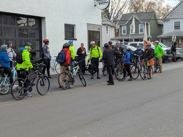 Bicyclists prepare for a Cranksgiving ride during which they will...