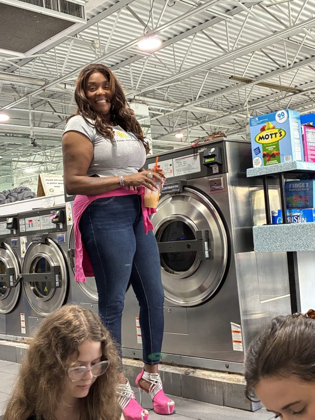Outreach manager Shaniqua Mitchell prepares snacks Tuesday, Oct. 21, 2025,...