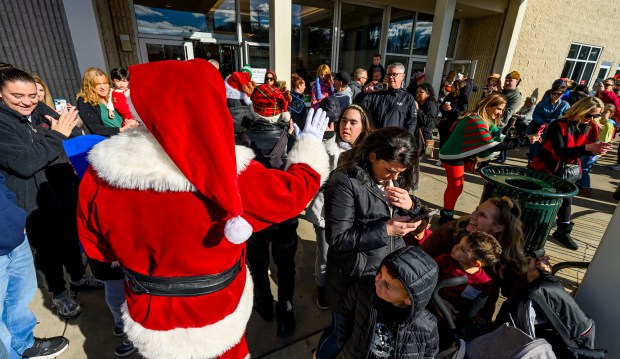 Santa arrives and greets shoppers Saturday, Nov. 29, 2025, during...