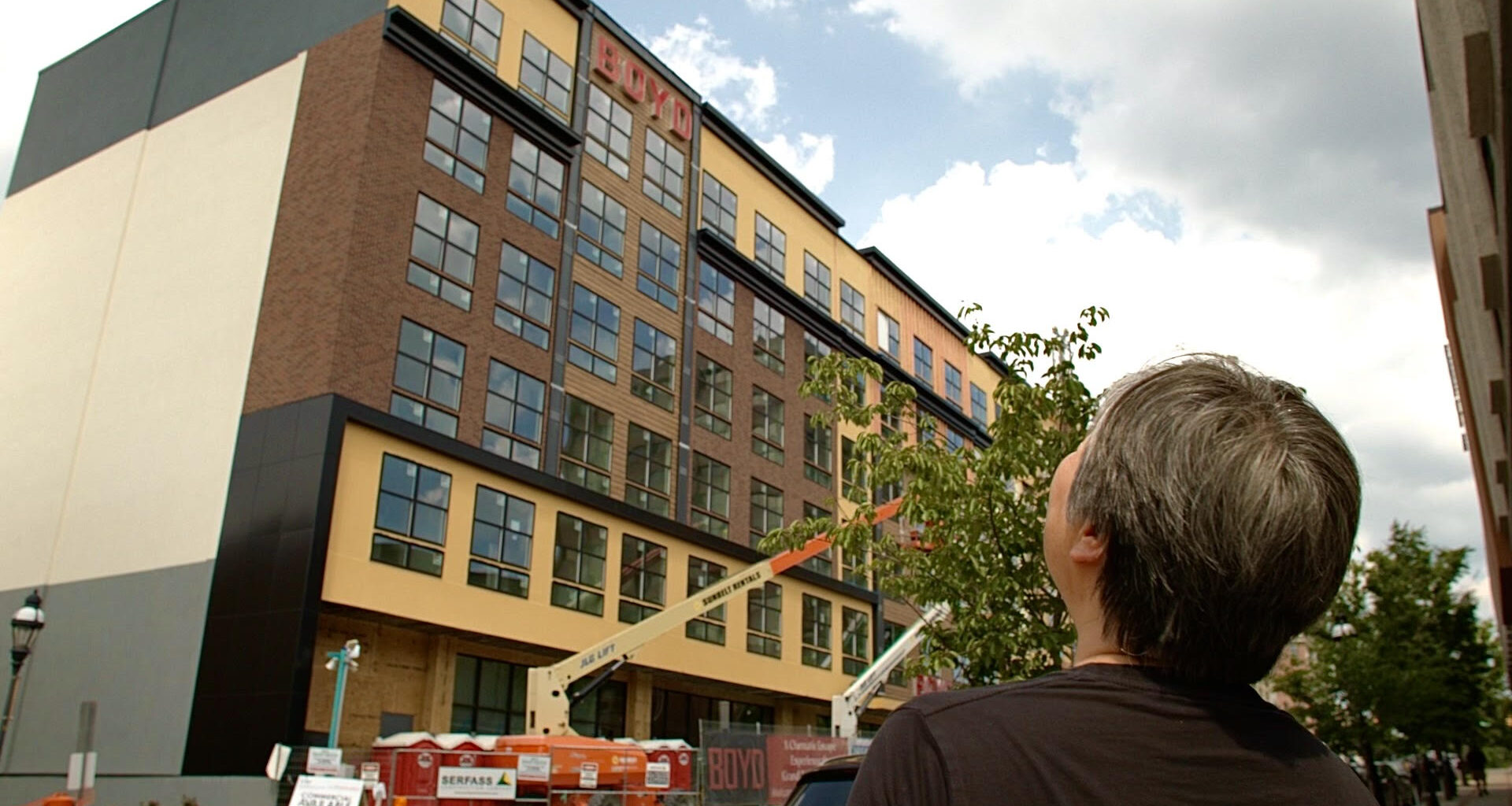 lan ma looks at future site of paris baguette in bethlehem pa at the new boyd apartment buildings