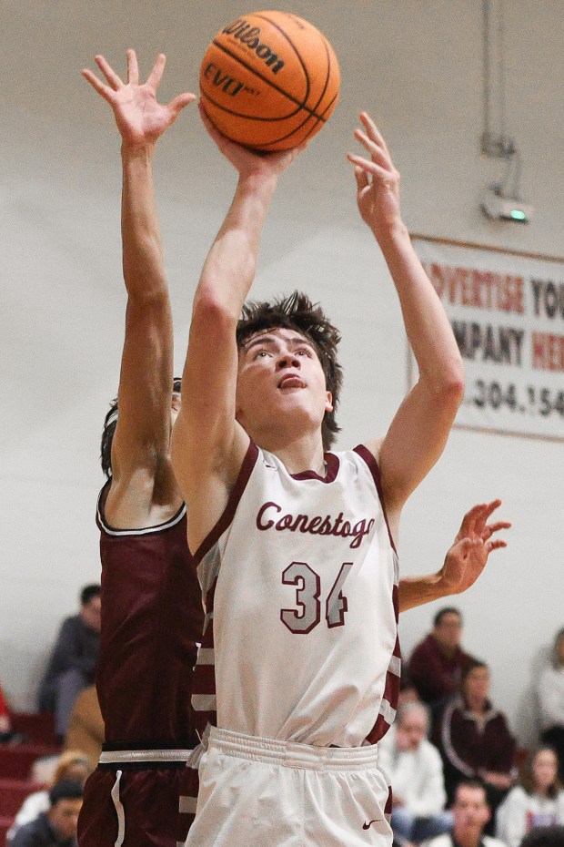 Conestoga's Logan Straub shoots a basket on Thursday against Lower Merion. Photo by Tom Silknitter.