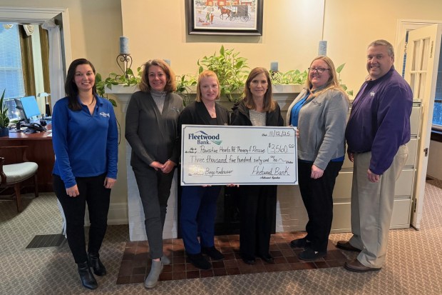 Pawsitive Hearts will allocate the $3,560 donation from Fleetwood Bank to help pay for vetting expenses and towards their building fund to purchase a shelter. (Photo courtesy of Fleetwood Bank)