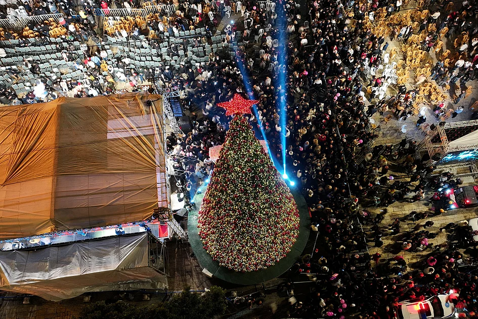 Bethlehem Christmas tree lights up for first time since start of Gaza war