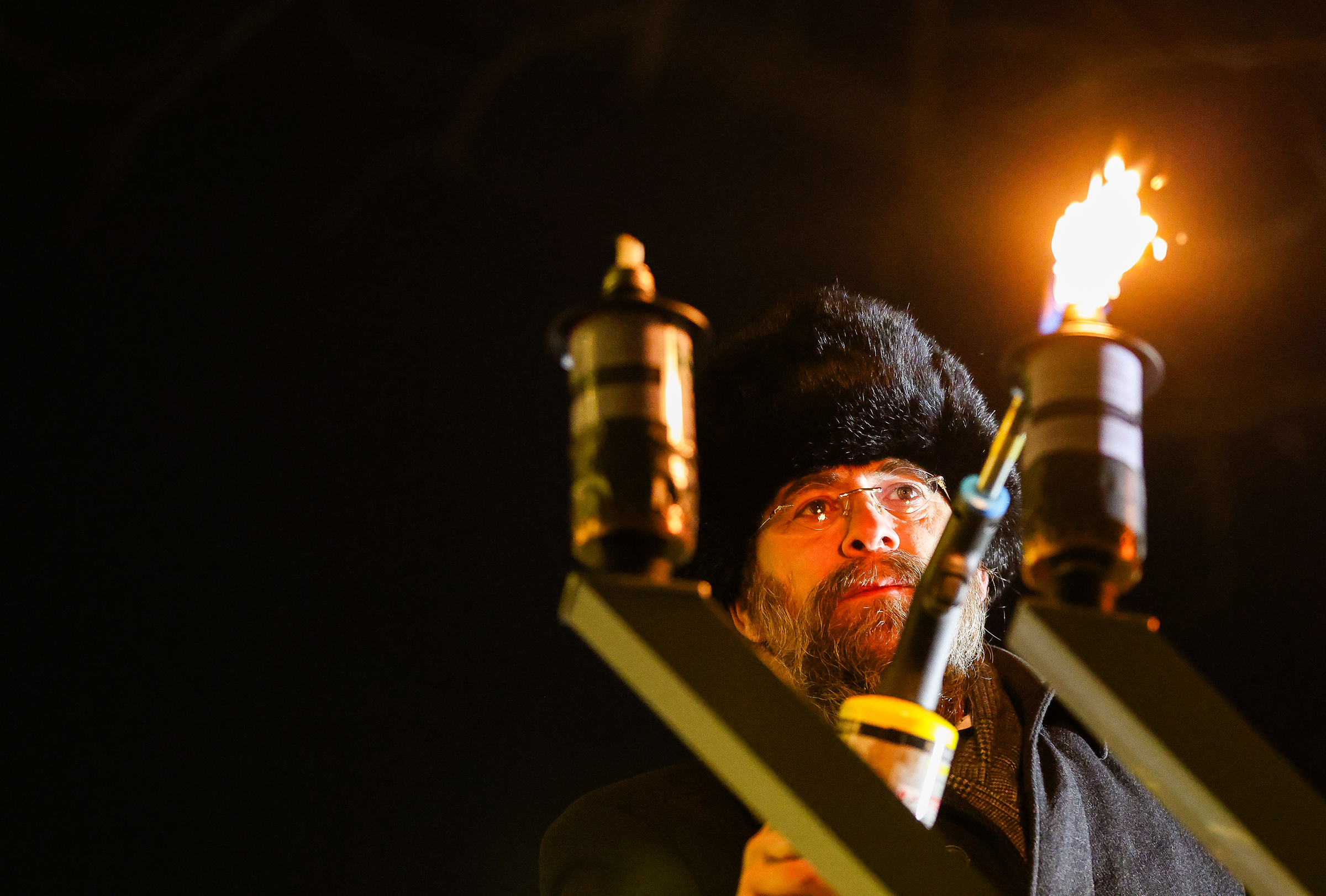 Rabbi Yaakov Halperin lights the menorah at Payrow Plaza Monday evening.  Chabad Lubavitch of the Lehigh Valley celebrates Hanukkah with a "Lighting of Unity" public menorah lighting Monday, Dec. 15, 2025, on Payrow Plaza outside Bethlehem City Hall.