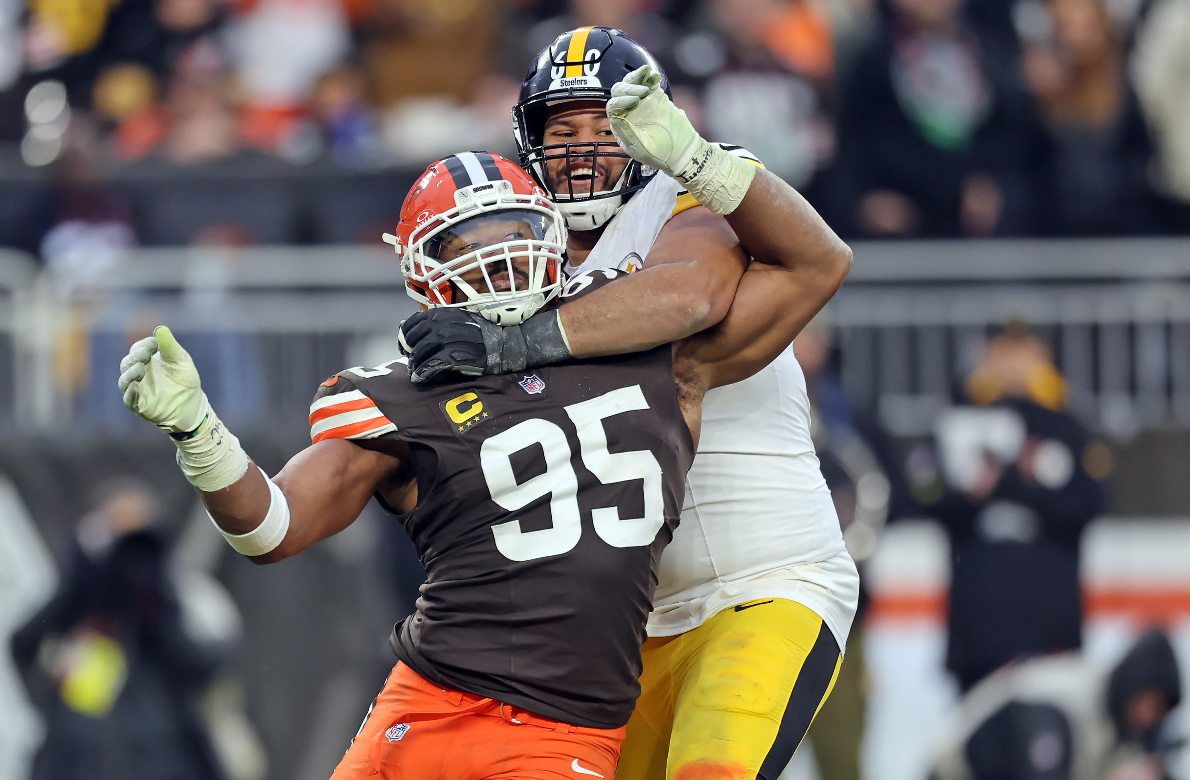 Pittsburgh Steelers offensive tackle Dylan Cook holds Cleveland Browns defensive end Myles Garrett in the second half of play. 