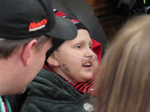 Riley Rejniak chats with guests at A Very Riley Christmas, a superhero-themed Christmas party held at Union Fire Company in Leesport on Dec. 17 in his honor. The 13-year-old, who had been battling cancer since he was in kindergarten, died Friday. (DAVID MEKEEL - READING EAGLE)