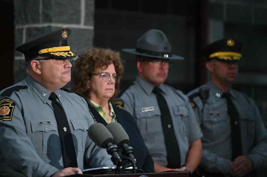 Pennsylvania State Police Commander Colonel Christopher L. Paris, left, talks about the Aug. 7 shootings in Susquehanna County.