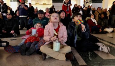 Children watching the Christmas Light Show at the Wanamaker Building.