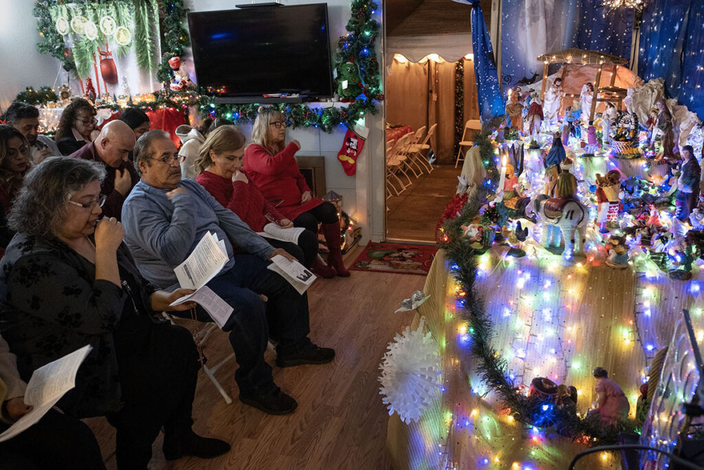 People gathered for a traditional Christmas posada recite the rosary in front of a Nativity scene in San Jose, Calif., Dec. 21, 2024. Commonly called Las Posadas, the celebration is popular in the U.S., Mexico and other areas of Latin America and reenacts Joseph and Mary's search for shelter on the eve of Christ's birth. About 60 friends, family and parishioners from St. Julie Billiart Catholic Church attended. (OSV News photo/David Maung)