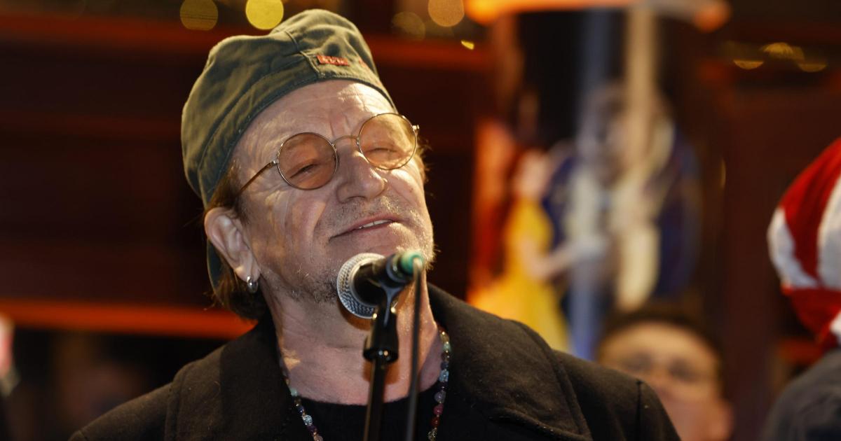 Bono joins annual Dublin city centre Christmas Eve busking session