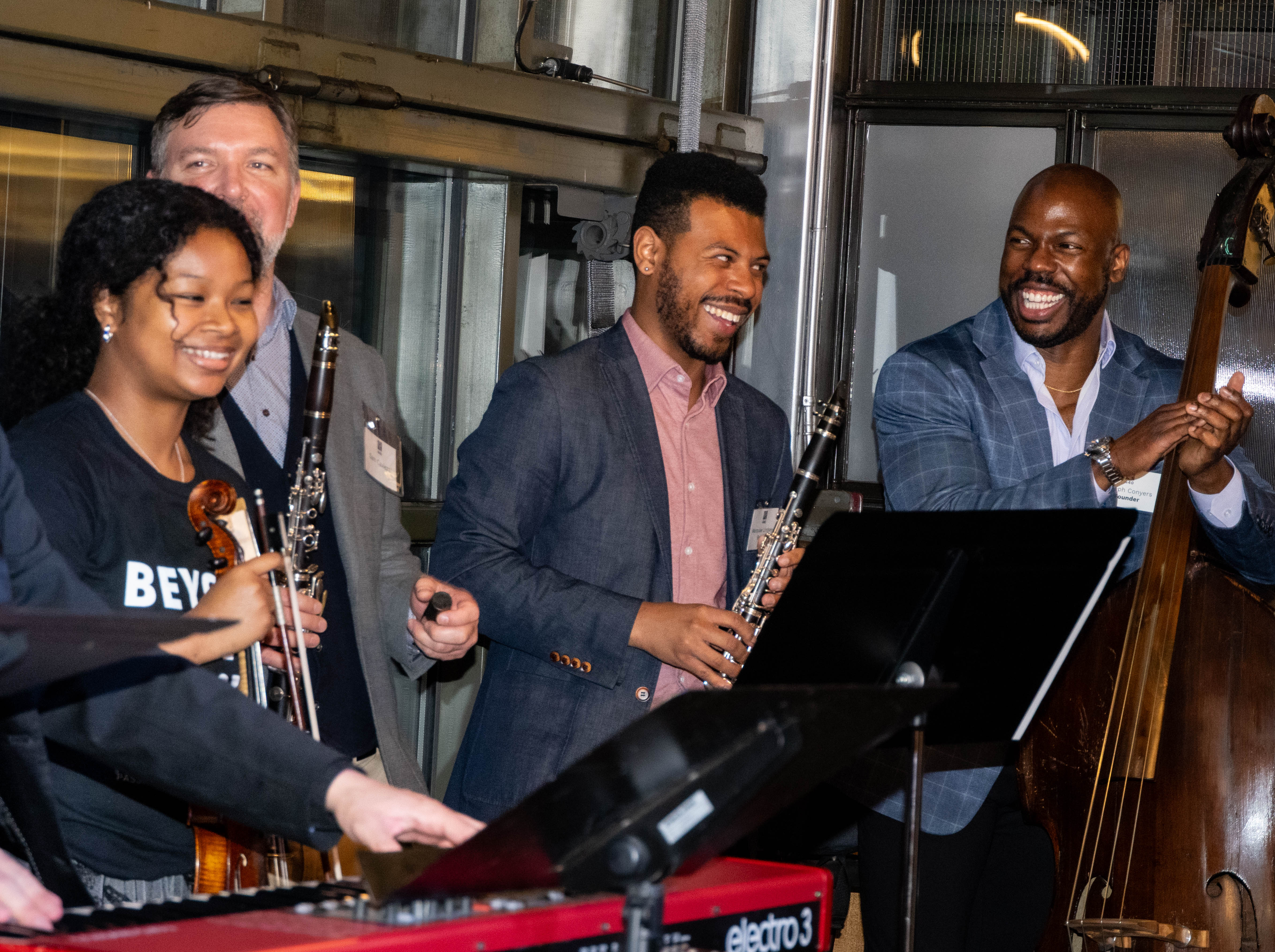 Joe Conyers with Project 440 alumni at Beyond the Music 2025. 