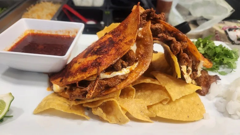 fried tacos and a side of tortilla chips