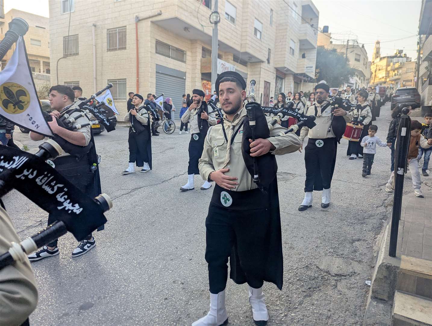 Scouts play bagpipes through Bethlehem. Photo: Fred Schlomka