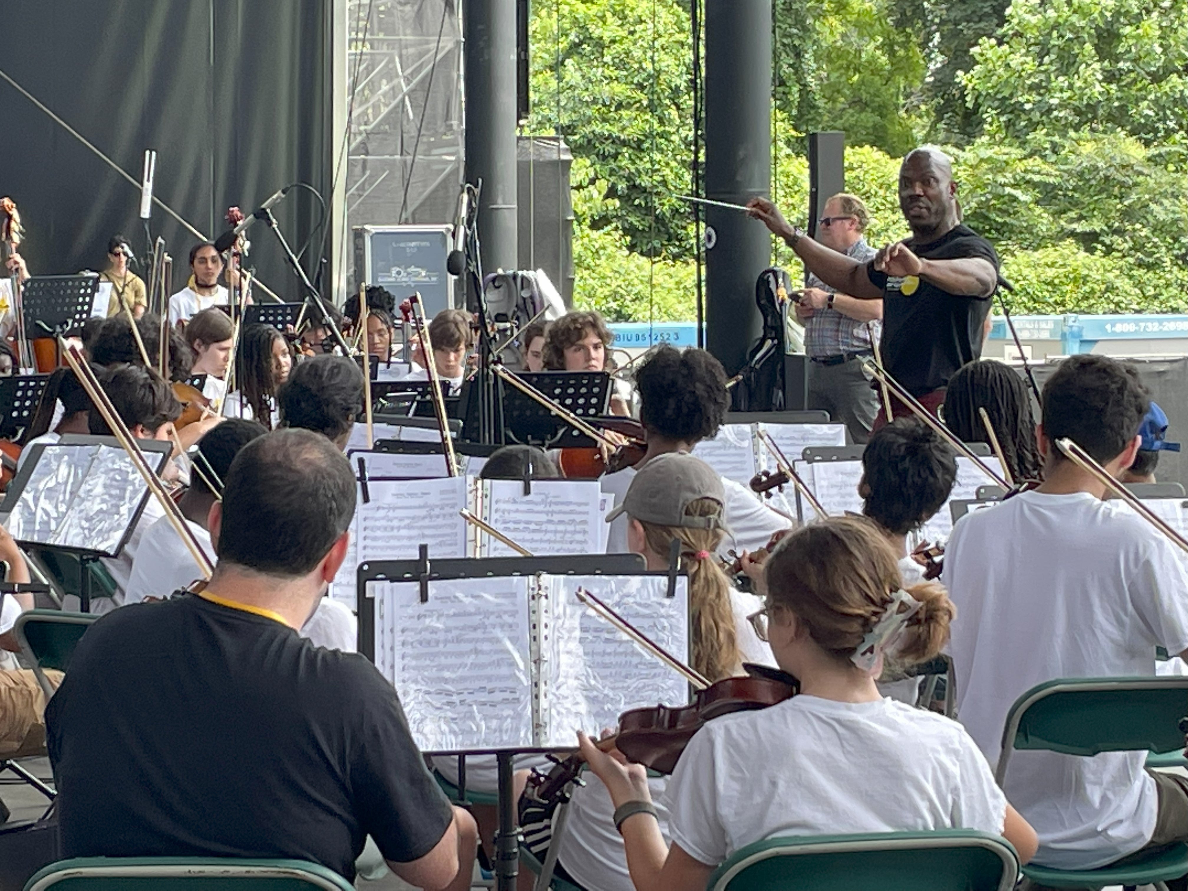 Joe Conyers conducting Philadelphia's All City Orchestra at the Mann Center in 2023.