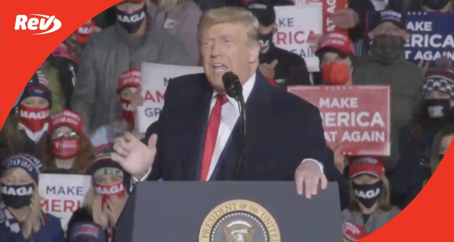 Donald Trump stands at a podium and speaks to a crowd at a rally.