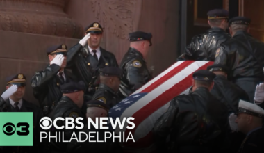 Procession for Officer Andy Chan arrives at Cathedral Basilica of Saints Peter and Paul