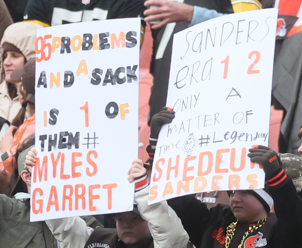 Cleveland Browns’ fans hold up signs hoping to witness Cleveland Browns defensive end Myles Garrett breaking the NFL record for sacks in a season.  