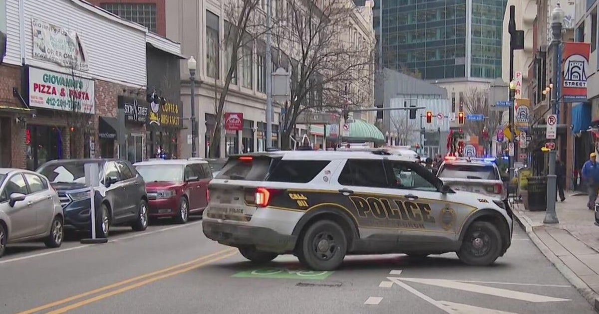 Two people arrested after police say man brandished rifle at worker in Downtown Pittsburgh