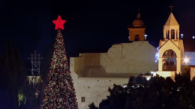 In first celebration since the Gaza war, Bethlehem’s Christmas tree shines bright