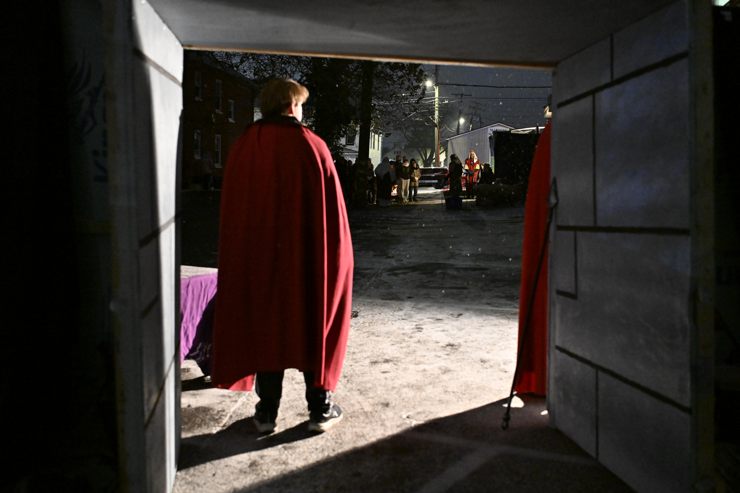 Guards stand at the gate to the city as travelers are seen in the distance during "A Night in Bethlehem" at Westminster United Methodist Church. (Thomas Walker/Freelance)