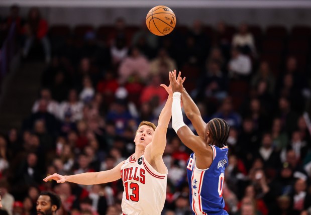 Chicago Bulls guard/forward Kevin Huerter (13) tries to block Philadelphia 76ers guard Tyrese Maxey's (0) shot in the first quarter during a game against the Philadelphia 76ers, Sunday, Dec. 26, 2025, at the United Center in Chicago. (Dominic Di Palermo/Chicago Tribune)