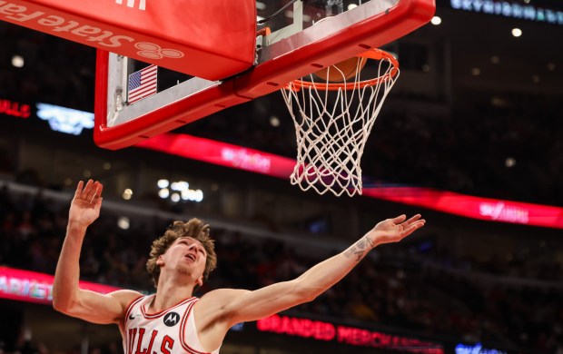 Chicago Bulls forward Matas Buzelis (14) makes a layup in the first quarter during a game against the Philadelphia 76ers, Sunday, Dec. 26, 2025, at the United Center in Chicago. (Dominic Di Palermo/Chicago Tribune)
