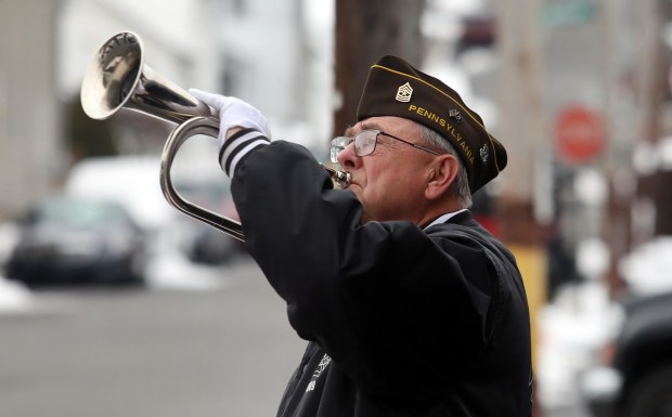 Veteran John Milewski plays Taps on Grant Street during a Pearl Harbor Remembrance Program held at the  Dupont Veterans of Foreign Wars Post 4909 Sunday morning December 7th 2025.