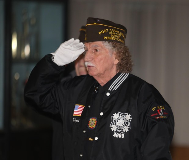 Veteran Robert Lopata salutes during the National Anthem at the start of a Pearl Harbor Remembrance Program held at the  Dupont Veterans of Foreign Wars Post 4909 Sunday morning December 7th 2025.