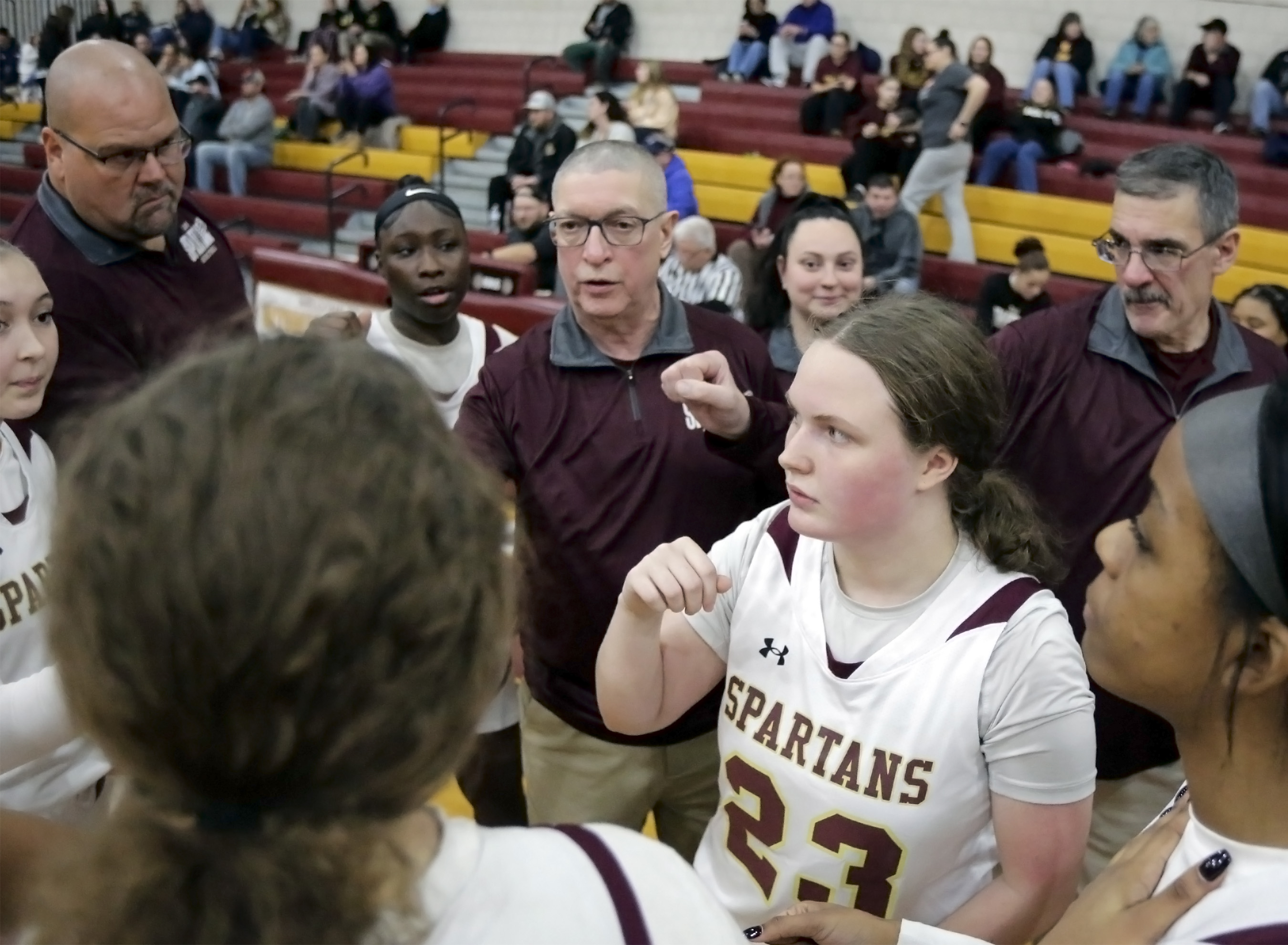 Wyoming Valley West head girls basketball coach Gary Ferenchick, center,...