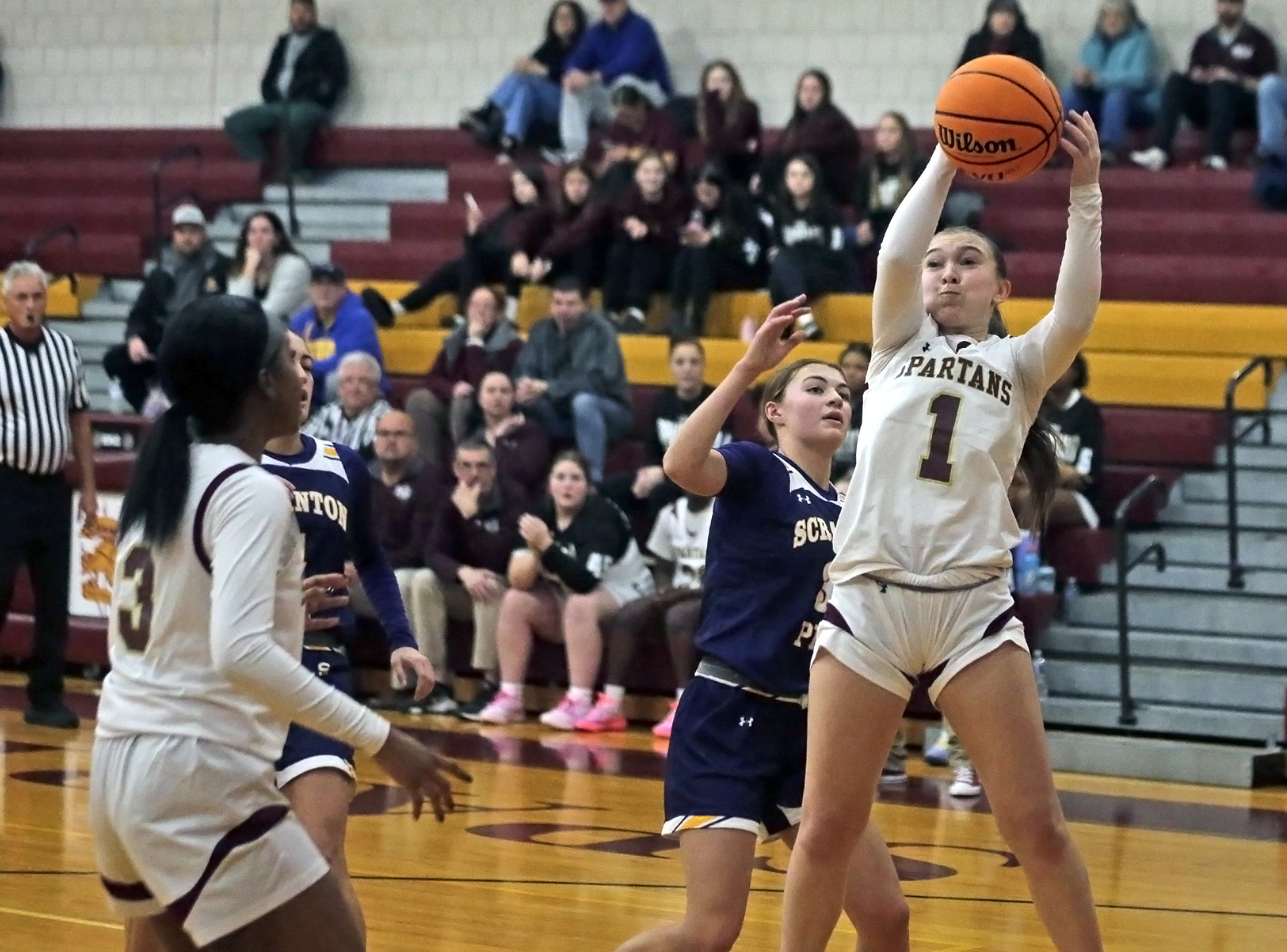 Wyoming Valley West’s Gabbi Novitski (1) grabs a defensive rebound...