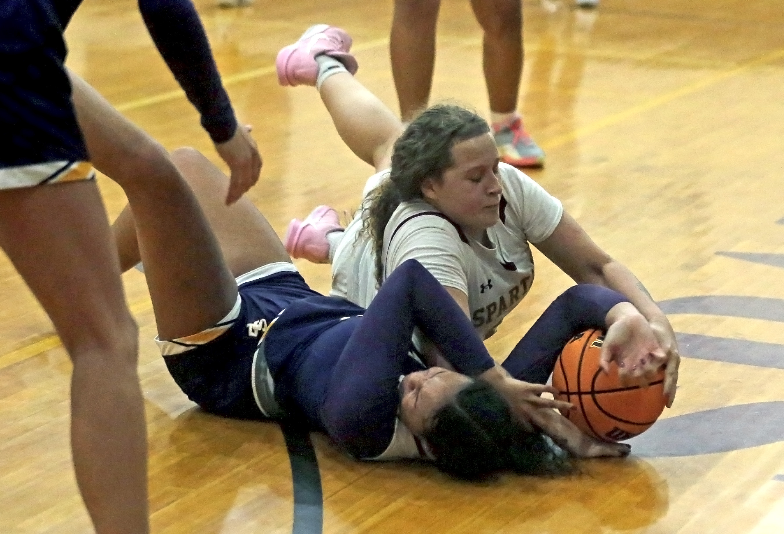 Wyoming Valley West’s Thalia Irizarry, back, battles for the ball...